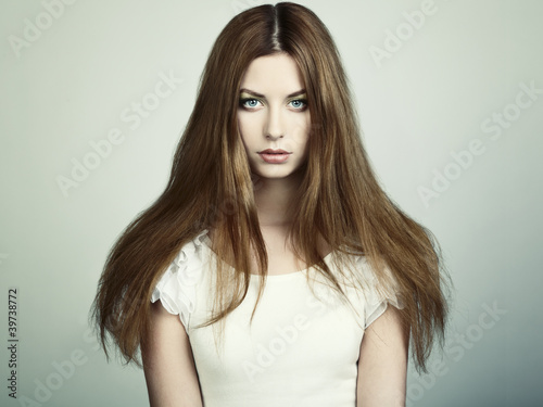 Photo: Fashion photo of a young woman with red hair Fashion photo of a young woman with red hair