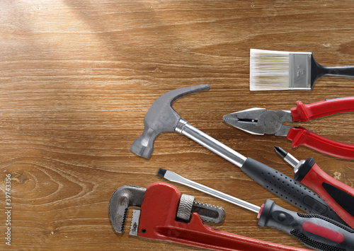 Photo: Set of tools on wood Set of tools on wood