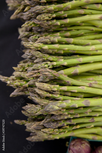 Photo: Freshly harvested organic asparagus spears with purple artichoke Freshly harvested organic asparagus spears with purple artichoke