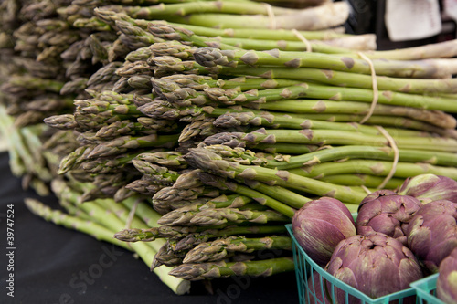 Photo: Freshly harvested organic asparagus spears with purple artichoke Freshly harvested organic asparagus spears with purple artichoke