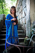 Photo: medieval girl next ancient spring medieval girl next ancient spring