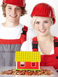 Young couple in overalls saving money for homestead