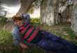 Portrait of an old lebanese man taking a nap in nature.