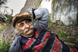 Portrait of an old lebanese man taking a nap in nature.