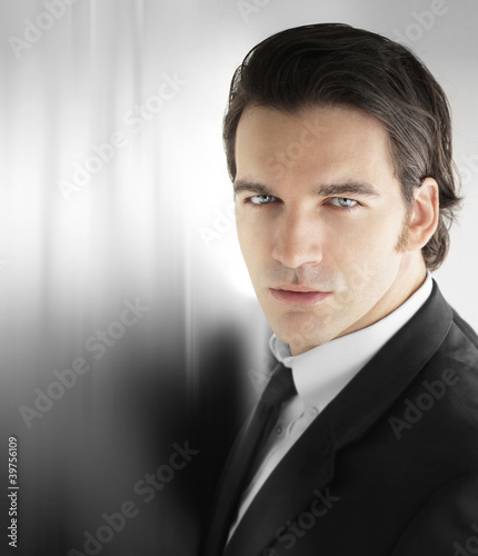 Photo: Action business man against metal Action business man against metal