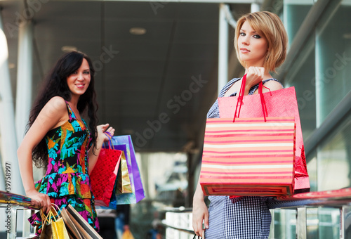 Photo: Young women with shopping bags Young women with shopping bags