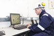 Young engineer working with computer in office