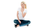 Pretty girl sitting on floor and smiling