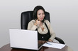 brunette working at her office desk