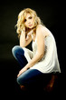 beautiful blond female model serious thinking