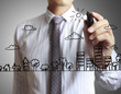 businessman drawing a building