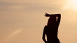 girl on the beach and evening sunset