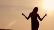 girl on the beach and evening sunset