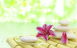 Flowers stones and soap near water in spa salon Flowers stones and soap near water in spa salon