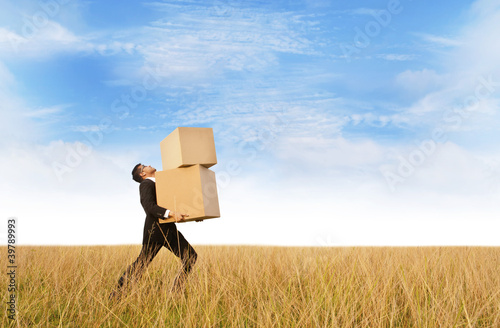 Photo: Businessman delivering boxes Businessman delivering boxes