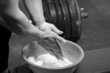 Closeup of hands of the weightlifter in talc