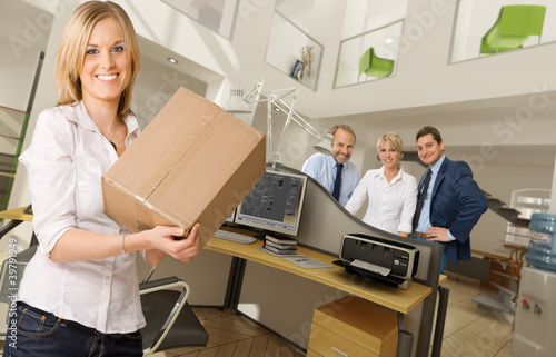 Photo: Girl with box at the office Girl with box at the office