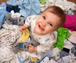 Baby in heap of wear