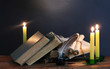 old books, scrolls, feather pen inkwell and candles