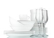 empty bowls, plates, cups and glasses on grey background
