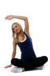 Photo: Young blonde woman stretching her muscles of her arms and back Young blonde woman stretching her muscles of her arms and back