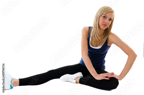 Photo: Fitness happy girl doing exercises on a floor Fitness happy girl doing exercises on a floor