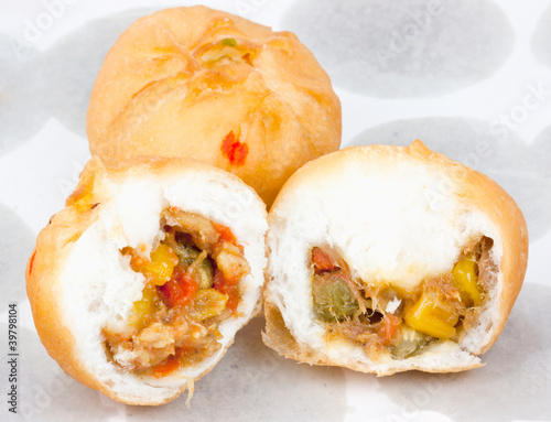 Photo: Dessert made of flour stuffed on oil clear sheet Dessert made of flour stuffed on oil clear sheet