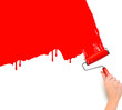 Hand with red roller painting the white wall Hand with red roller painting the white wall