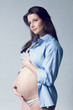 Beautiful pregnant white woman wearing blue shirt Beautiful pregnant white woman wearing blue shirt