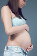 Beautiful pregnant white woman wearing. Hands on belly. Beautiful pregnant white woman wearing. Hands on belly.