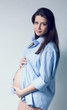 Beautiful pregnant white woman wearing blue shirt Beautiful pregnant white woman wearing blue shirt