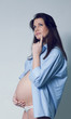 Beautiful thinking smiling pregnant white woman Beautiful thinking smiling pregnant white woman