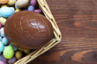 Large chocolate easter egg in a basket
