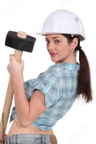 Photo: sexy woman holding a huge hammer sexy woman holding a huge hammer