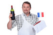 Frenchman with a bottle of red and a raw steak