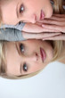 Studio shot of a woman looking at her reflection in a mirror