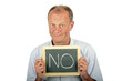 Thoughtfull man showing a sign with '' NO'' written on it