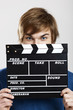 Showing a clapboard Showing a clapboard