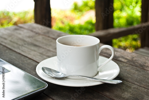 Photo: Coffee cup and laptop for business. Coffee cup and laptop for business.