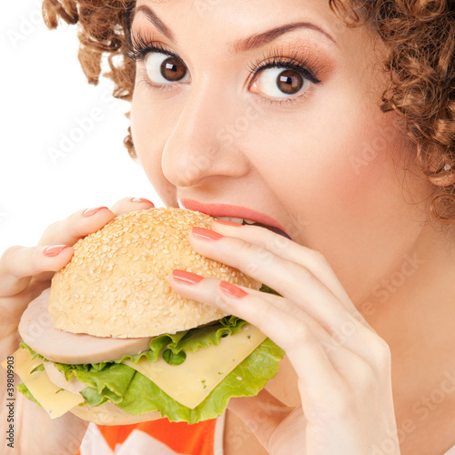 Foto: Fun woman with sandwich on the white background Fun woman with sandwich on the white background