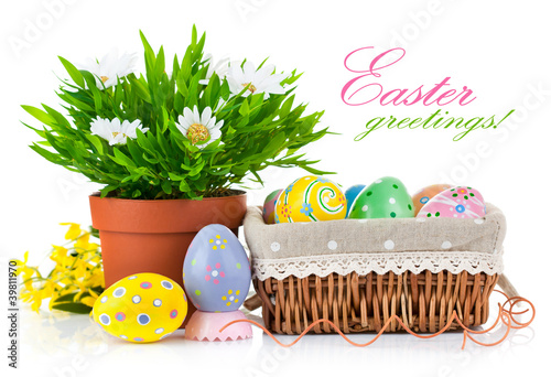 Photo: easter eggs in basket with spring flowers easter eggs in basket with spring flowers
