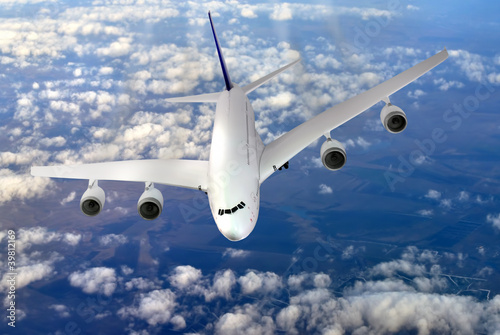 Photo: Modern airplane in the sky near Airport. Modern airplane in the sky near Airport.