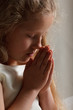 young girl praying