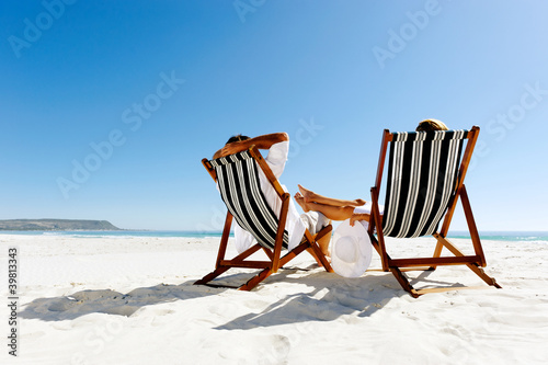 Photo: summer relaxing beach couple summer relaxing beach couple