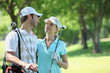 portrait of a couple in golf clothes