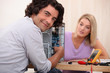 Couple repairing computer