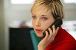 Austere woman talking on the phone