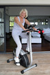 Older woman using an exercise bike