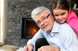 Grandfather and granddaughter playing