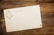 Photo: Retro 1900th postcard on wooden table Retro 1900th postcard on wooden table